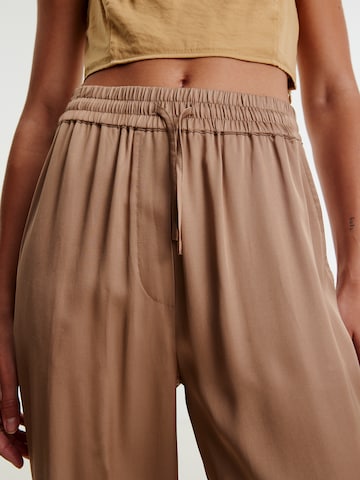 EDITED Loose fit Trousers 'Stina' in Brown