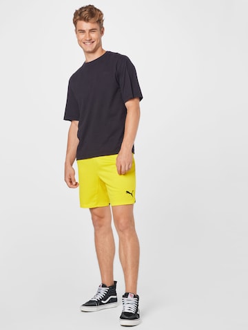 PUMA Regular Workout Pants 'BVB' in Yellow