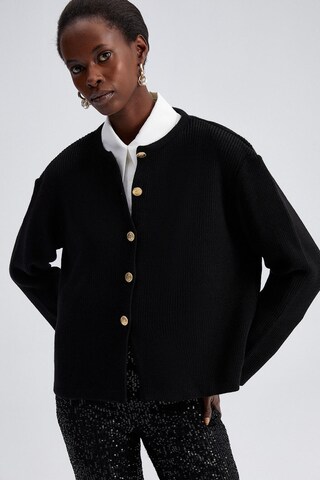 Touche Prive Strickjacke in Schwarz: Vorderseite