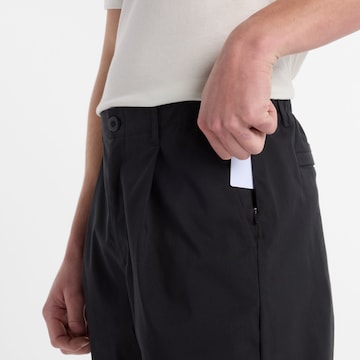 Loosefit Pantalon à pince 'Athletics' new balance en noir
