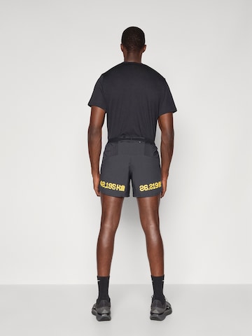 NIKE Ohlapna forma Športne hlače 'CITY MRTH STRIDE' | črna barva