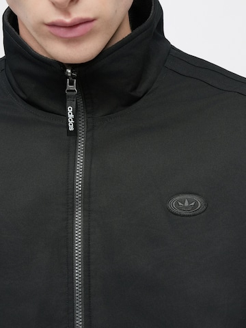 ADIDAS ORIGINALS Between-season jacket 'FIREBIRD' in Black