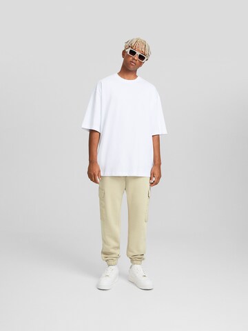 Bershka Tapered Cargo trousers in White