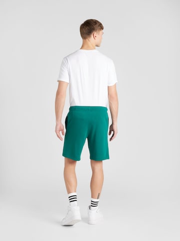 Regular Pantaloni de la Champion Authentic Athletic Apparel pe verde