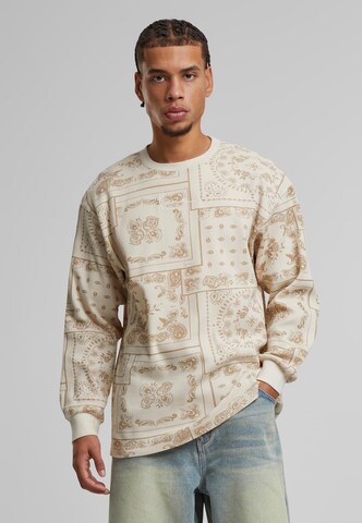 T-Shirt Karl Kani en marron : devant