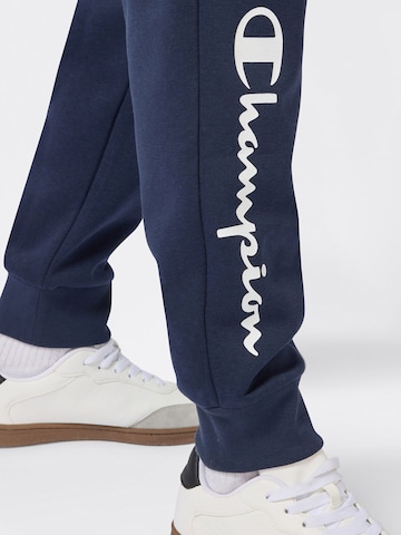 Champion Authentic Athletic Apparel Zwężany krój Spodnie w kolorze niebieski