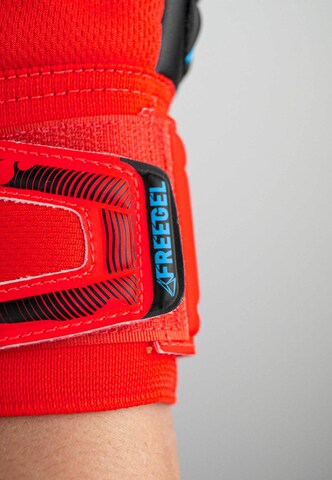 REUSCH Sports gloves 'Attrakt Freegel Silver' in Red
