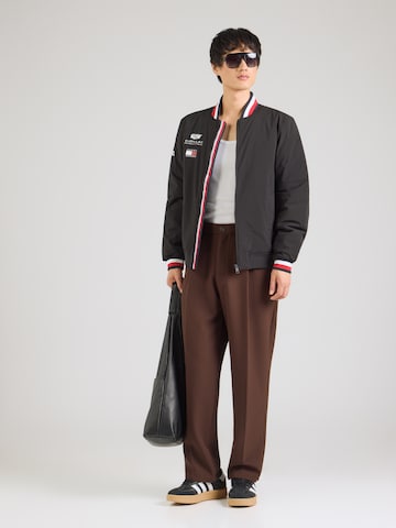 TOMMY HILFIGER Prechodná bunda 'TH x CF1 REPLICA VARSITY' - Čierna