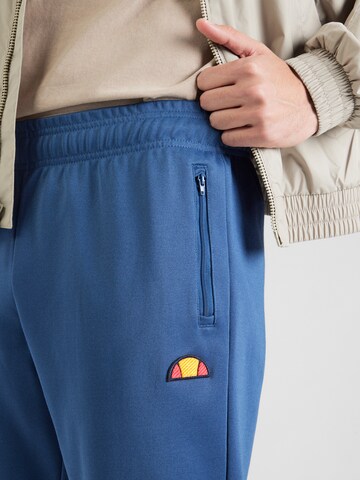 ELLESSE Tapered Pants 'Bertoni' in Blue