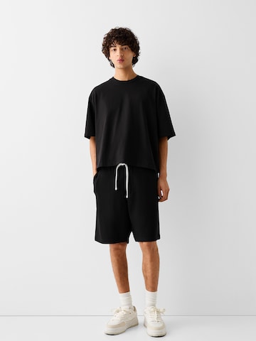 Bershka Loosefit Shorts in Schwarz