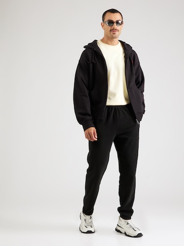 THE NORTH FACE - Tapered Calças de desporto 'GLACIER' em preto