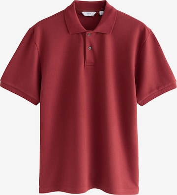 Tricou de la Next pe roșu: față