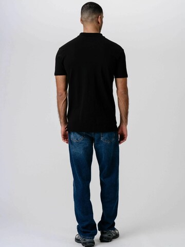 Coupe regular Chemise ' Muscle Polo ' TEESHOPPEN en noir