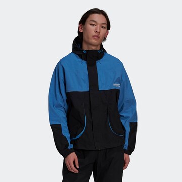 ADIDAS ORIGINALS - Chaqueta de entretiempo en azul