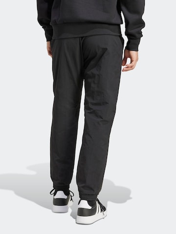 Tapered Pantaloni sport 'SL 2' de la ADIDAS SPORTSWEAR pe negru