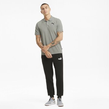 PUMA Poloshirt in Grau