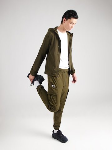 Effilé Pantalon de sport 'Vibe' UNDER ARMOUR en vert