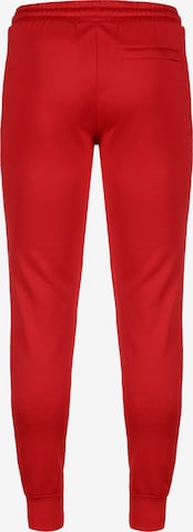 PUMA - Tapered Calças 'Iconic T7' em vermelho