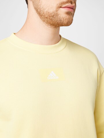 ADIDAS SPORTSWEAR Sports sweatshirt 'Essentials Feelvivid  Fleece Drop Shoulder' in Yellow