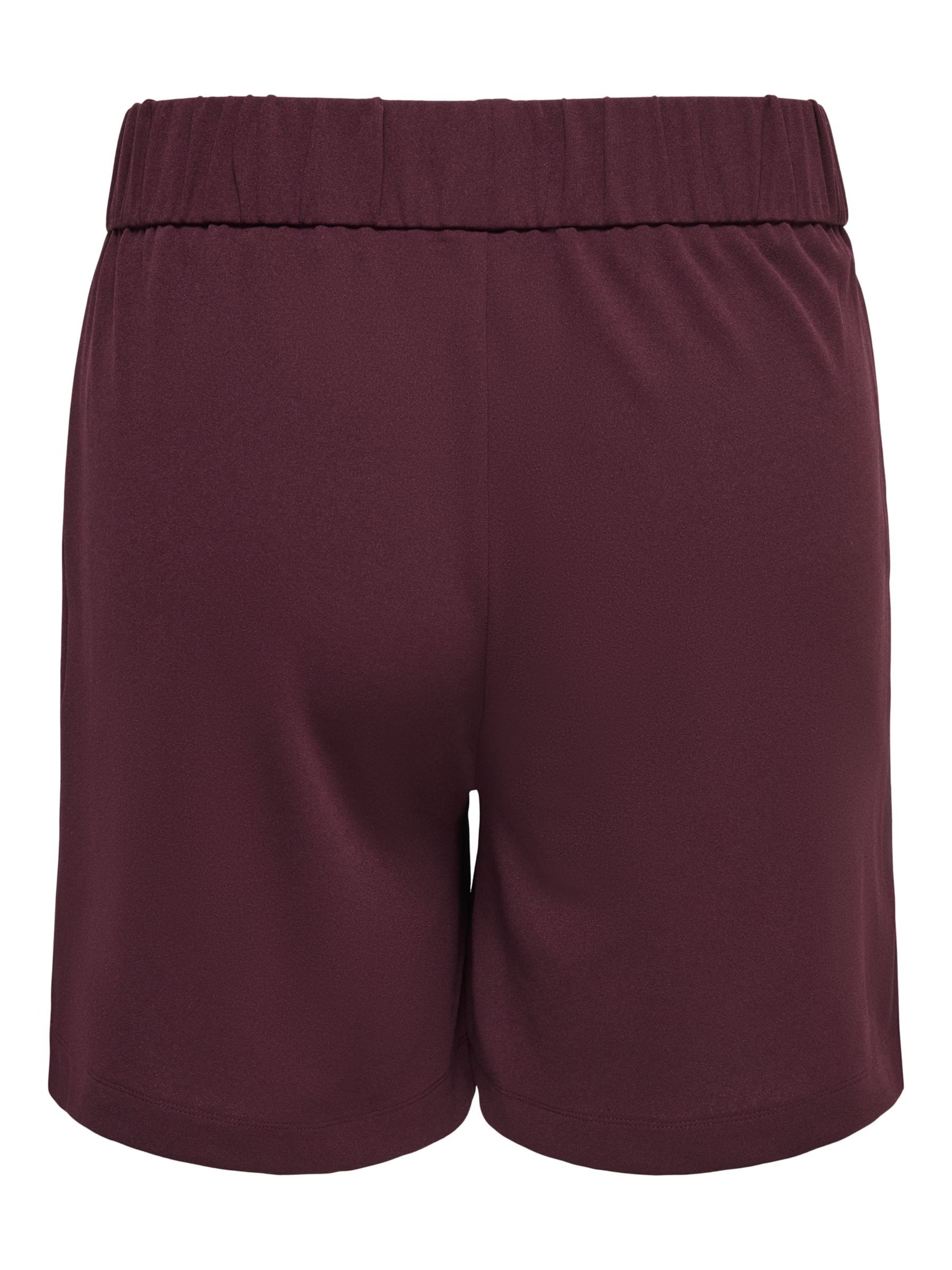 regular Pantaloni con pieghe di ONLY Carmakoma in rosso