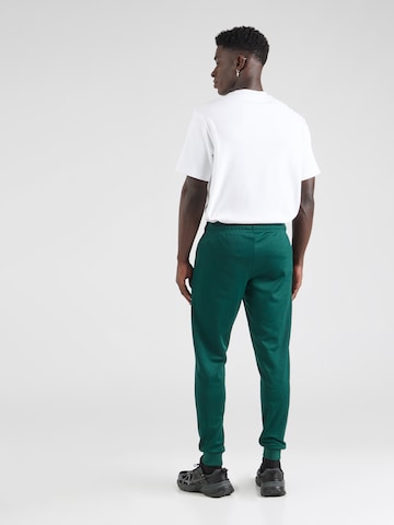 ELLESSE - Tapered Pantalón 'Bertoni' en verde