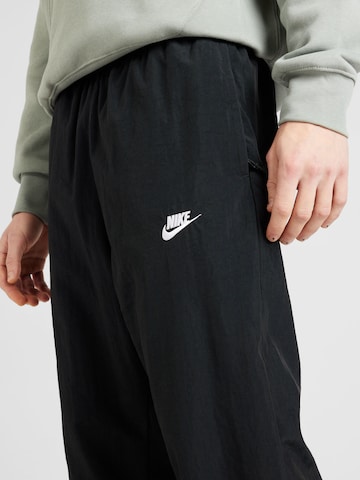 Tapered Pantaloni de la Nike Sportswear pe negru