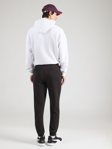 PUMA Конический (Tapered) Спортивные штаны 'ESS' в Черный