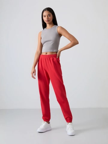 Pantalon Tommy Life en rouge