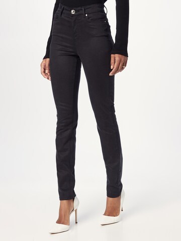 GUESS Skinny Jeans in Black: front