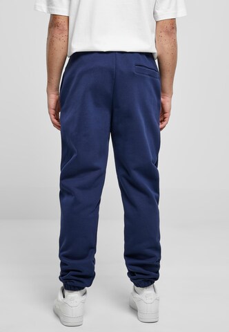 Tapered Pantaloni di Urban Classics in blu