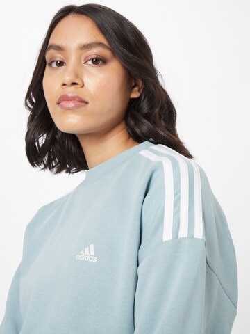 ADIDAS SPORTSWEAR Urheilullinen collegepaita värissä sininen