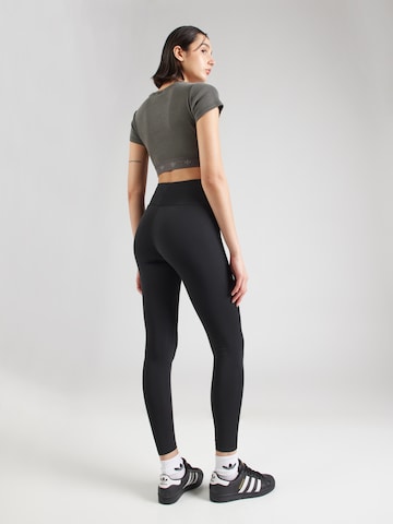 Skinny Leggings 'ESS' di ADIDAS ORIGINALS in nero