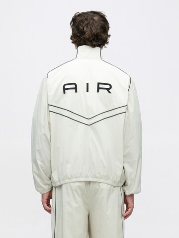 Nike Sportswear Prehodna jakna 'AIR' | bež barva: sprednja stran