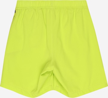 NIKE Štandardný strih Športové nohavice - Žltá