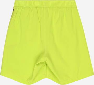 NIKE Regular Sports trousers in Yellow