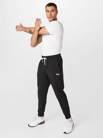 PUMA Tapered Sportbroek 'Train Vent' in Zwart