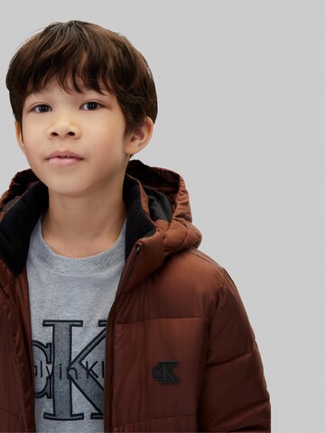 ruda Calvin Klein Jeans Žieminė striukė 'Essential'