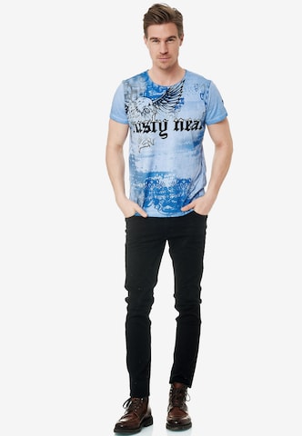 Rusty Neal Cooles T-Shirt mit Allover-Print in Blau