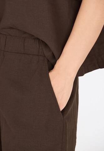 Athlecia Loose fit Sports trousers 'Resort' in Brown