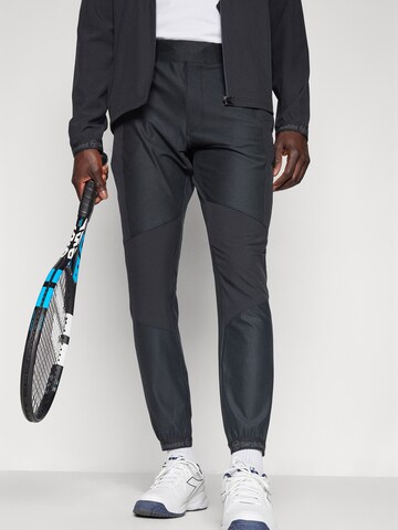 Sergio Tacchini Zwężany krój Spodnie sportowe 'Pelle' w kolorze czarny