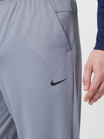 NIKE Regularen Športne hlače 'Totality' | siva barva