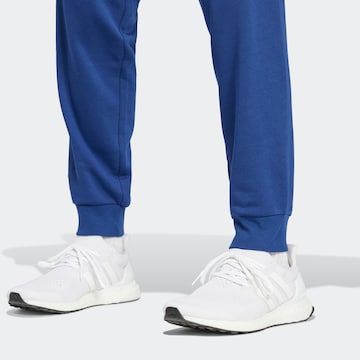 Effilé Pantalon de sport 'FEELCOZY' ADIDAS SPORTSWEAR en bleu