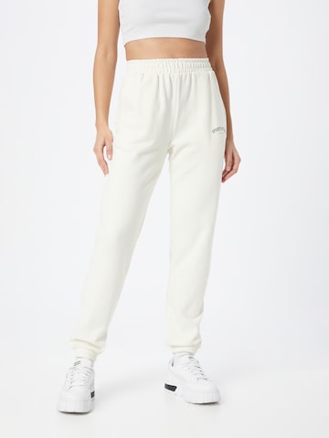 Athlecia Tapered Workout Pants in White: front