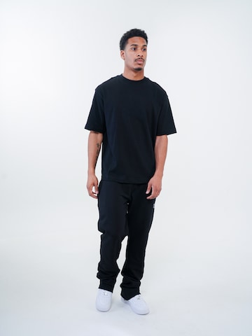 ATELIER OF FAITH Loosefit Broek in Zwart: voorkant