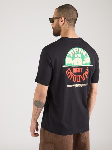 Champion Authentic Athletic Apparel T-shirt i svart: framsida