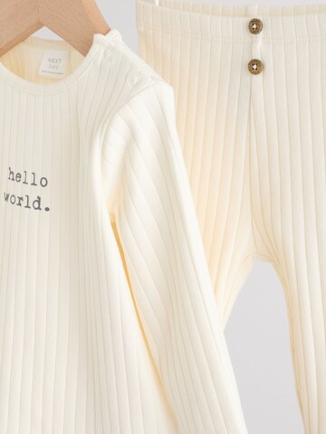 Set de la Next pe bej