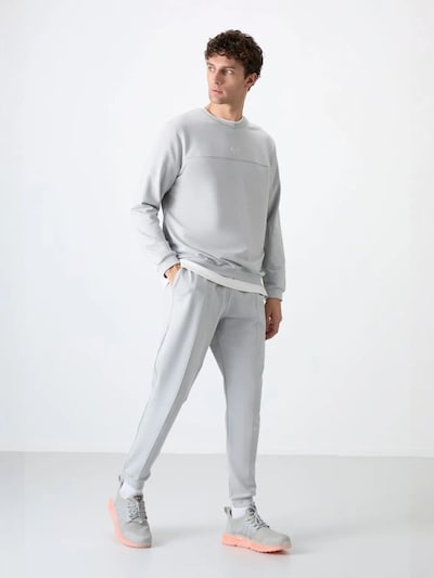 Tuta da jogging in L Tommy Life di colore grigio chiaro, Visualizzazione prodotti