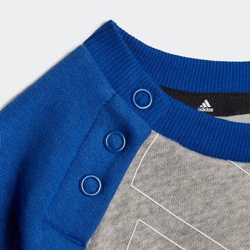 ADIDAS SPORTSWEAR Trainingspak 'Essentials Logo And' in Blauw