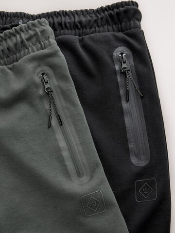 Tapered Pantaloni di Next in grigio