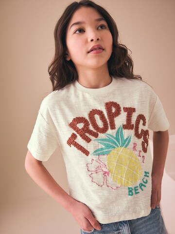 Tricou de la Next pe bej